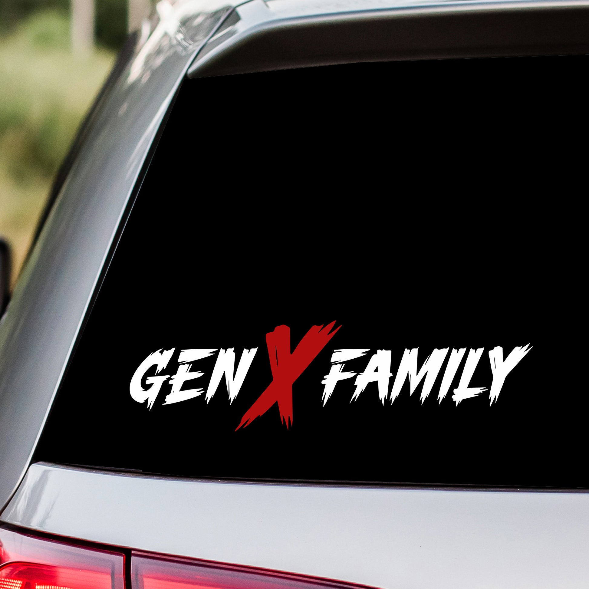 Car window with 'GEN X FAMILY' decal on a black background