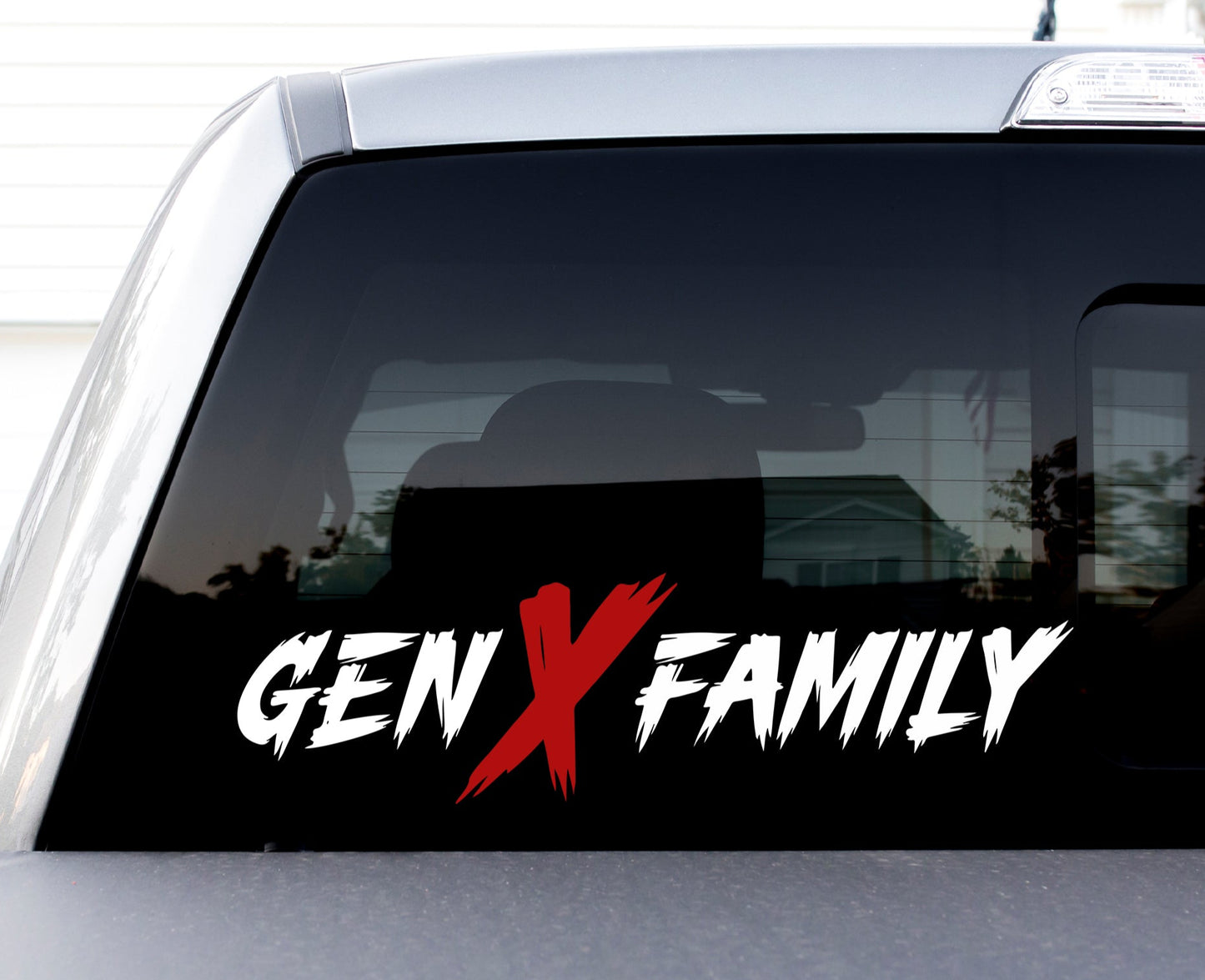 Car window with 'GENX FAMILY' decal on a white background
