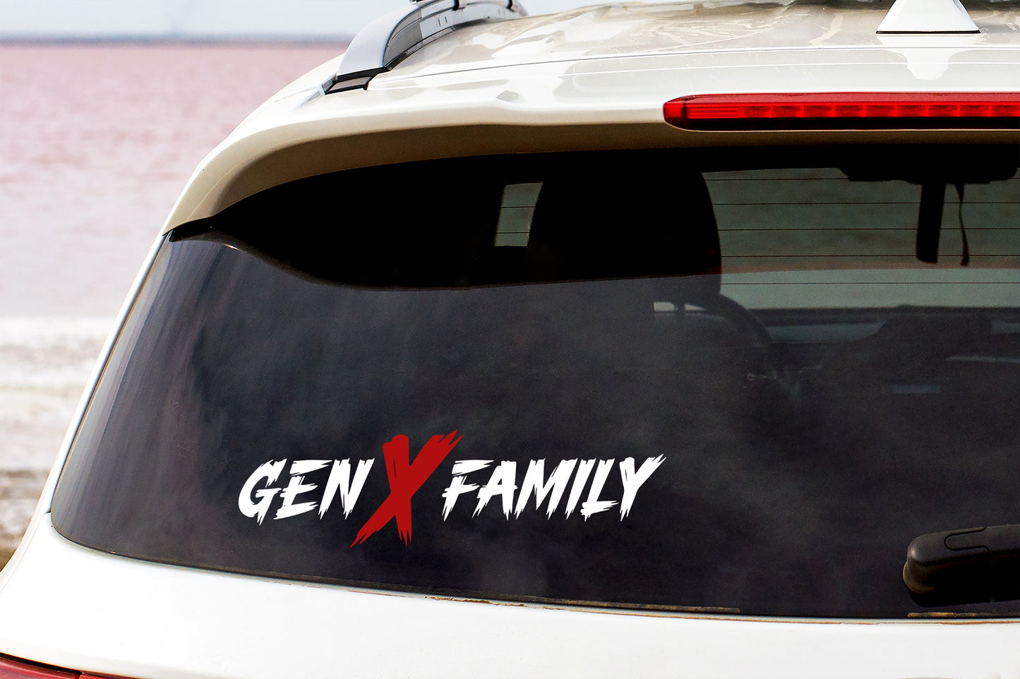 Car window with 'GEN X FAMILY' decal on a vehicle