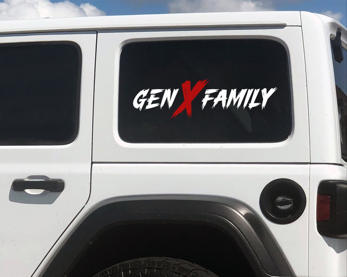 White vehicle with 'GENX FAMILY' decal on a clear day